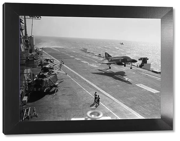 HMS Ark Royal steaming in the English Channel - Phantom aircraft landing on deck with