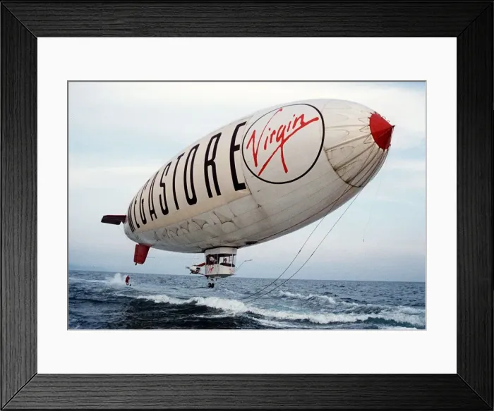 Framed Print : Virgin Airship - A man water skis behind an airship flying low over the sea Framed Print : Virgin Airship - A man water skis behind an airship flying low over the sea