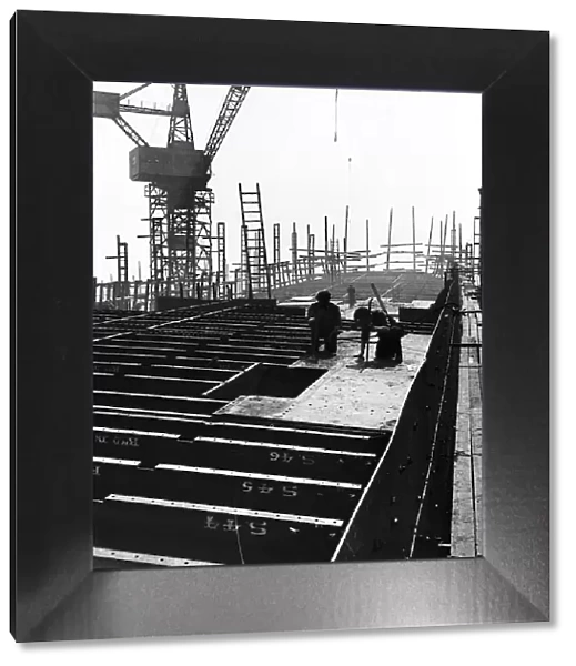 General view of Shipbuilders at work in a shipyard Circa 1955