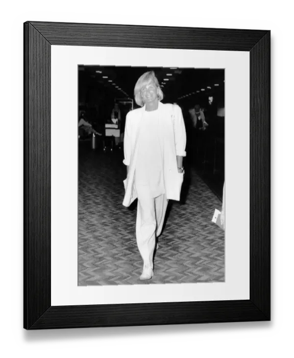 Framed Print : Linda Evans American Actress walking through the departure lounge at Heathrow Airport