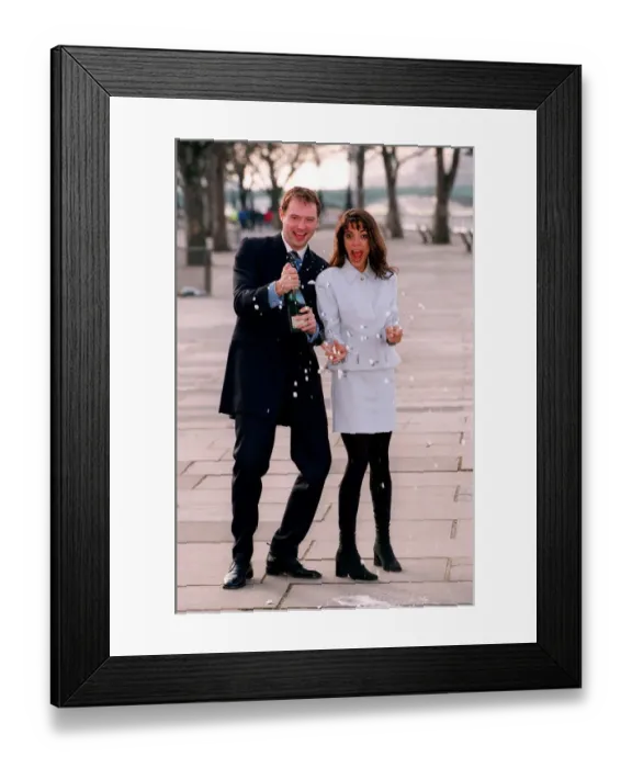 Framed Print : Jenny Powell TV Presenter with the new Wheel Of Fortune presenter John Leslie