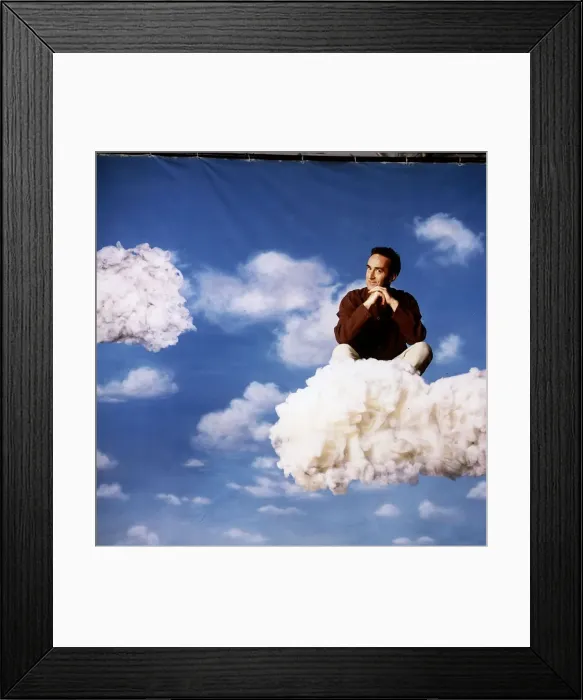 Framed Print : Angus Deayton TV presenter sitting on cloud in sky background back drop Framed Print : Angus Deayton TV presenter sitting on cloud in sky background back drop