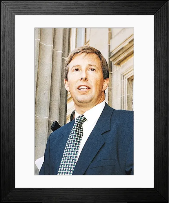 Framed Print : TV presenter Bill McFarlan wearing blue suit and green and blue spotted tie