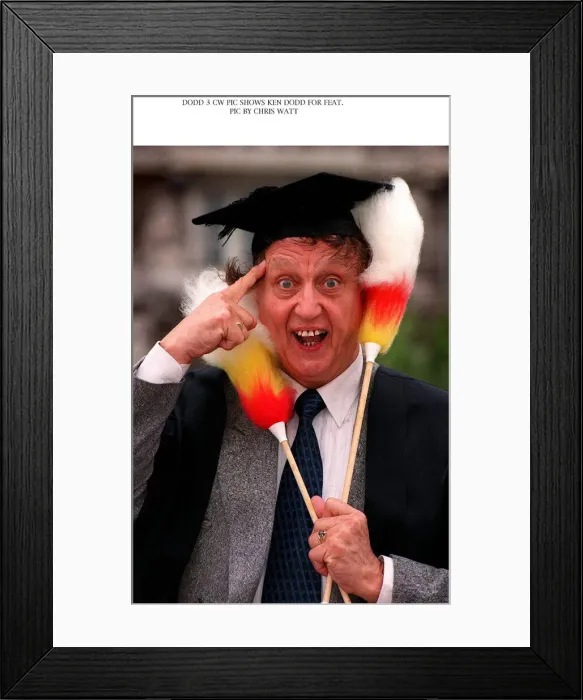 Framed Print : Ken Dodd comedian waring mortar board hat Ken Dodd after being made an honorary fellow