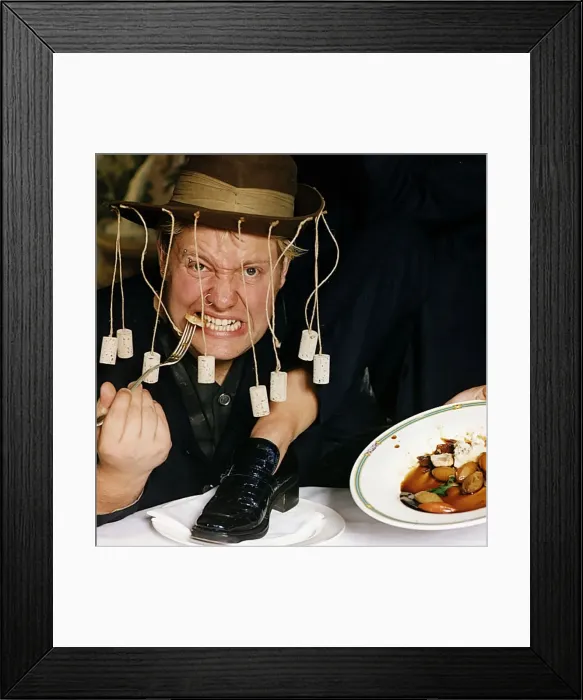 Framed Print : Ewan MacLeod TV presenter reporter eating crocodile burger crocodile shoe on plate Framed Print : Ewan MacLeod TV presenter reporter eating crocodile burger crocodile shoe on plate