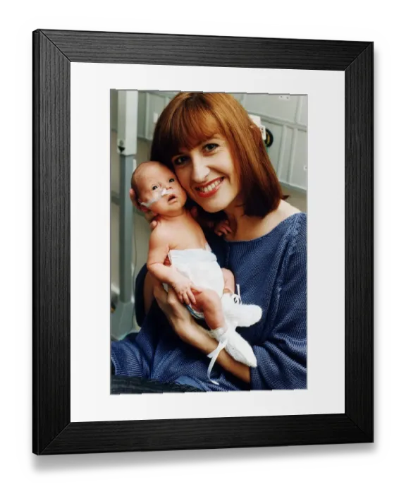 Framed Print : TV presenter Jackie Bird holding her baby Jacob March 1995
