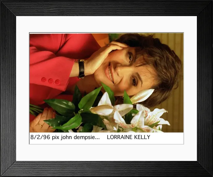 Framed Print : Lorraine Kelly TV presenter sitting next to green white plant Framed Print : Lorraine Kelly TV presenter sitting next to green white plant