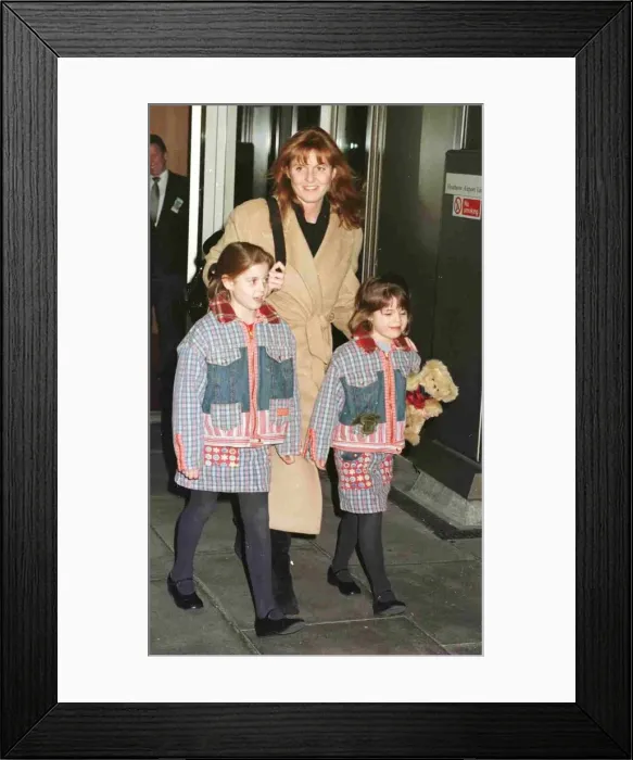 Framed Print : Duchess Of York and children Princess Beatrice and Princess Eugenie leave Heathrow for