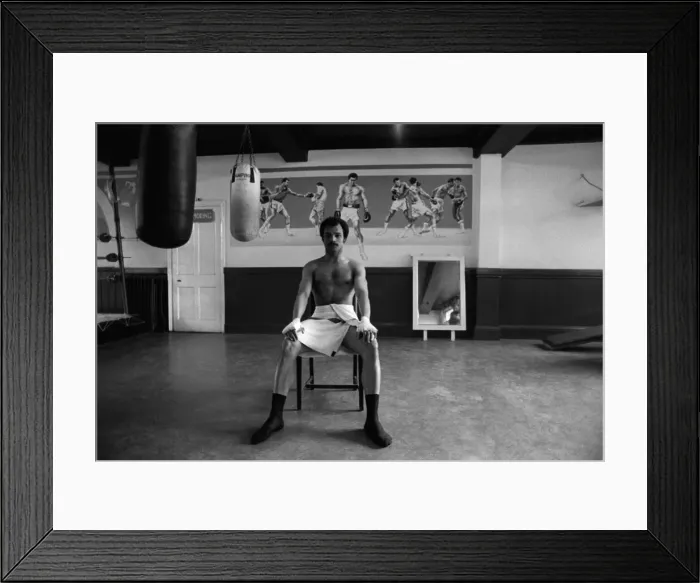 Framed Print : John Conteh in his boxing club having a rest from training