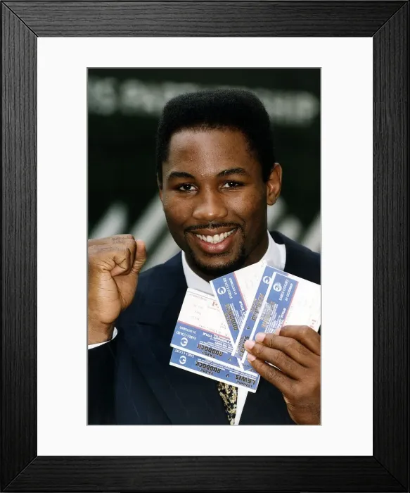 Framed Print : Lennox Lewis Heavyweight Boxer holding tickets to Razor Ruddock fight Framed Print : Lennox Lewis Heavyweight Boxer holding tickets to Razor Ruddock fight