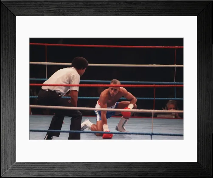 Framed Print : Lloyd Honeyghan boxer on the canvas being counted Mar 90 by the boxing referee
