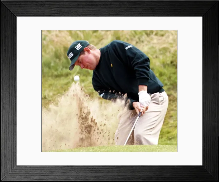 Framed Print : Lee Westwood hits out of a bunker on the second hole during the third round of the Open Framed Print : Lee Westwood hits out of a bunker on the second hole during the third round of the Open
