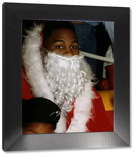 Lennox Lewis WBC World Boxing heavyweight champion at Sky TV dressed up as Santa Claus
