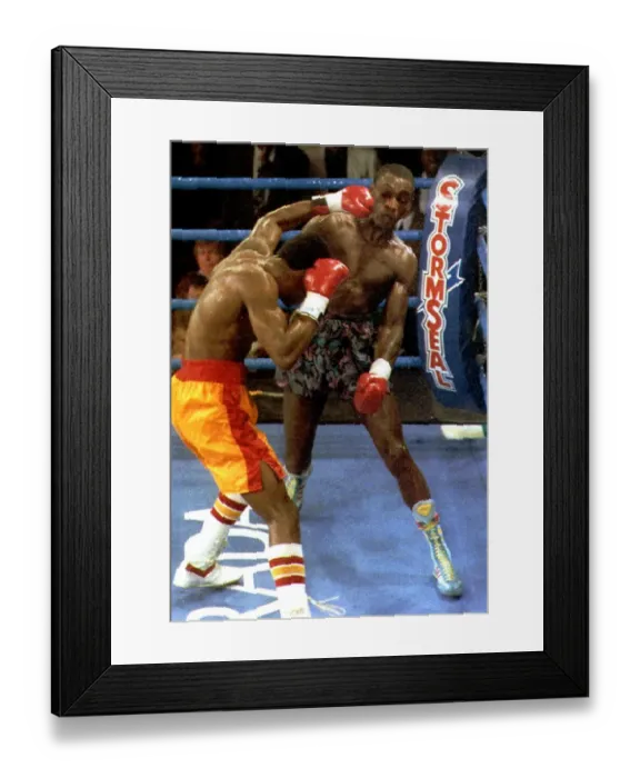 Framed Print : Herol Graham Boxer takes a left Hook from Julian Jackson during their fight in