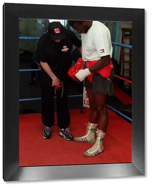 Herbie Hide Boxer putting on boxing gloves with his trainner Jim Mcdonnell
