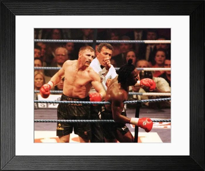 Framed Print : Steve Collins connects with Nigel Benn during WBO Super Middleweight contest in Framed Print : Steve Collins connects with Nigel Benn during WBO Super Middleweight contest in