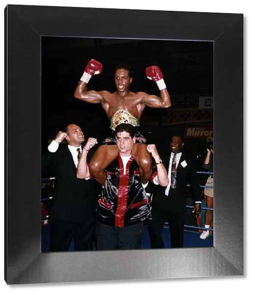 Nigel Benn Boxing hoisted shoulder high by trainer Jimmy Tibbs