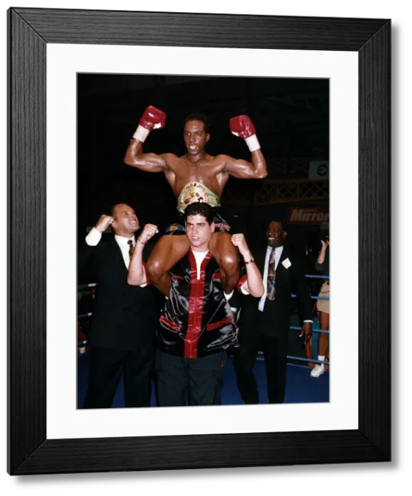 Framed Print : Nigel Benn Boxing hoisted shoulder high by trainer Jimmy Tibbs