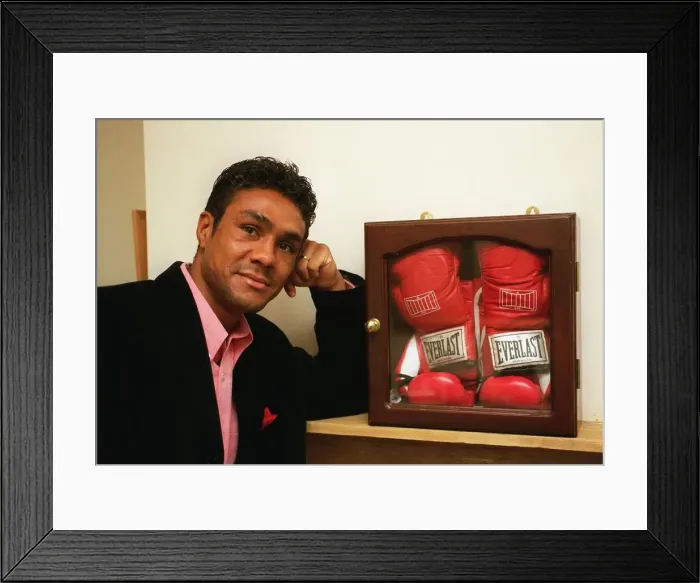 Framed Print : Boxer Kevin Lveshing at home in Westerham standing in front of cased boxers gloves