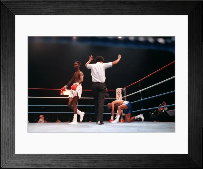 Framed Print : Lloyd Honeyghan boxer knocked down by Breland Mar 90 with boxing referee arms Framed Print : Lloyd Honeyghan boxer knocked down by Breland Mar 90 with boxing referee arms