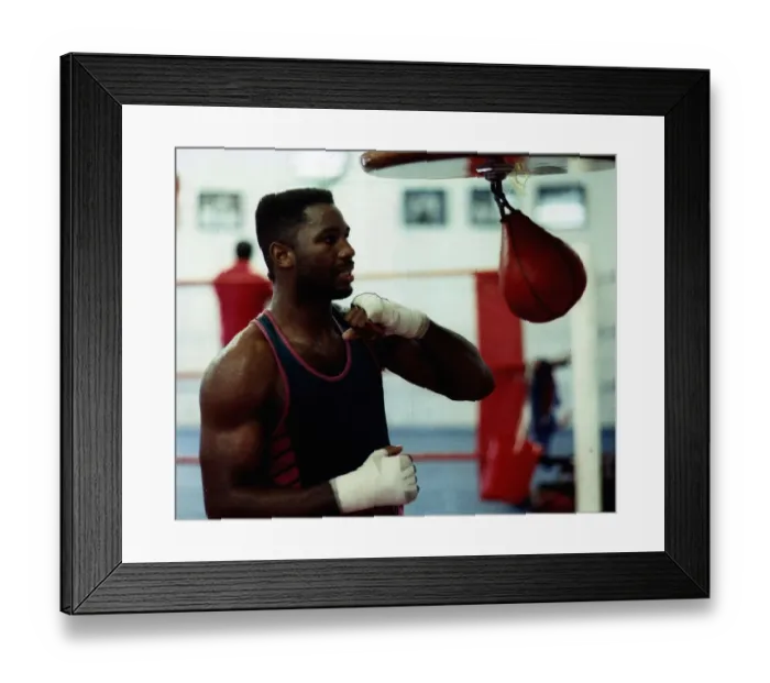 Framed Print : Lennox Lewis Boxing trains in the gym by hitting the speed ball