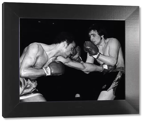 John Conteh Boxer throws a body punch to Les Stevens during their Fight