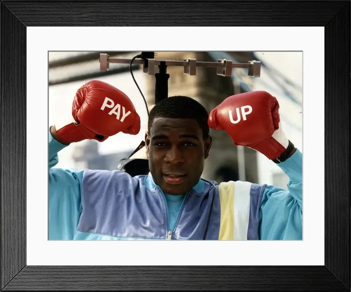 Framed Print : Frank Bruno Boxing Standing under tv aerial wearing boxing gloves