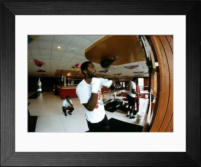Framed Print : Lennox Lewis Boxing Heavyweight boxer training in the gym punching punch ball Framed Print : Lennox Lewis Boxing Heavyweight boxer training in the gym punching punch ball