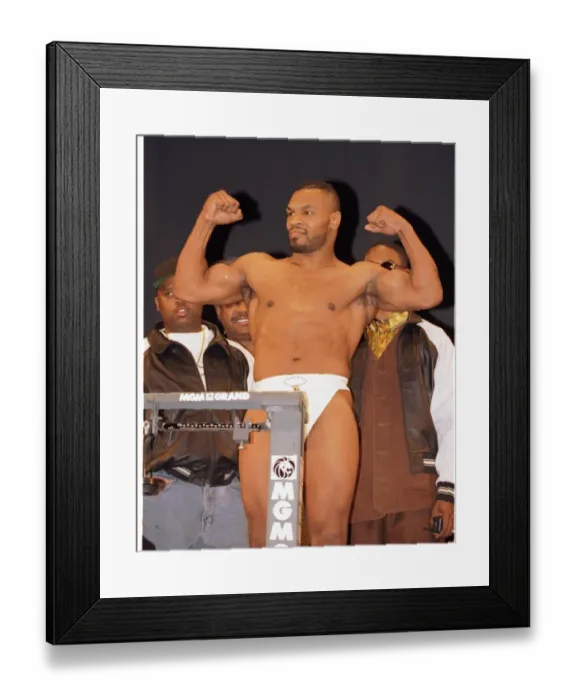 Framed Print : Mike Tyson flexes his muscles at the weigh in. Ready for the fight against Frank Bruno in