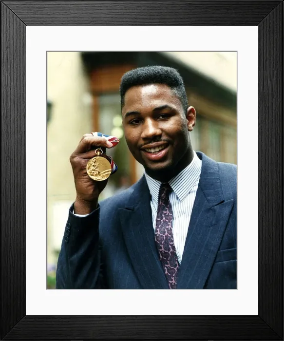 Framed Print : Lennox Lewis boxer holding gold medal April 1989