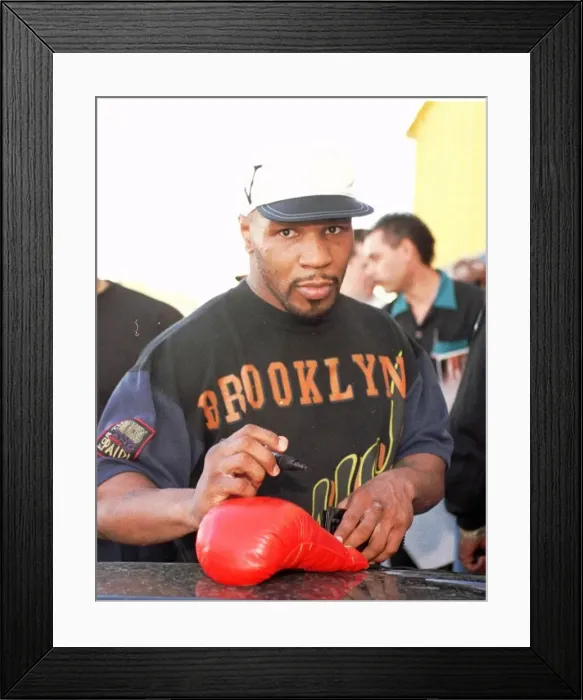 Framed Print : Mike Tyson signs autographs for fans after training Framed Print : Mike Tyson signs autographs for fans after training