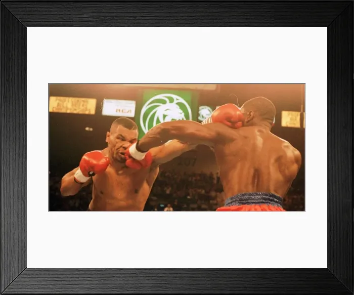 Framed Print : Frank Bruno and Mike Tyson exchange punches during the WBC world title fight in Las Vegas