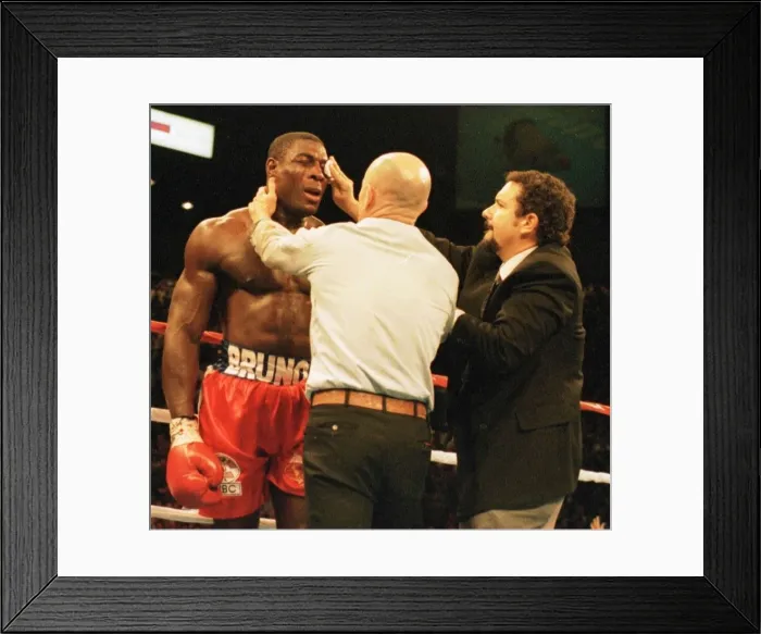 Framed Print : Frank Bruno gets attention at the end of the fight after his defeat in three Framed Print : Frank Bruno gets attention at the end of the fight after his defeat in three