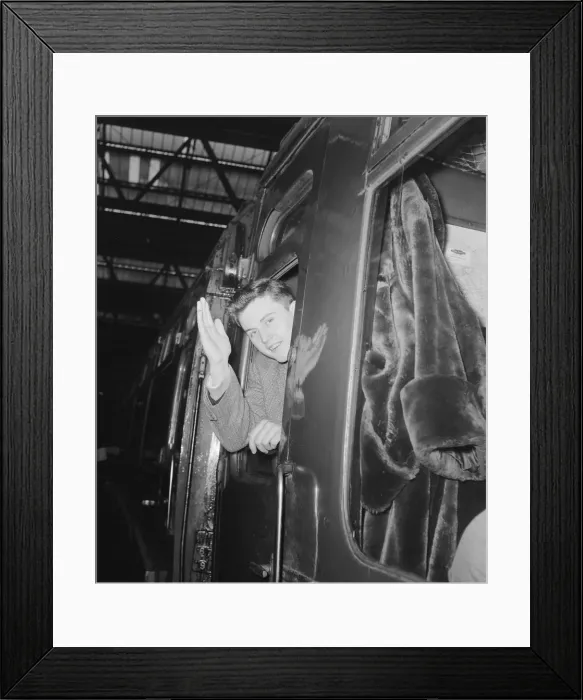 Framed Print : British pop singer Terry Dene waving from the train carriage window as he leaves for Framed Print : British pop singer Terry Dene waving from the train carriage window as he leaves for
