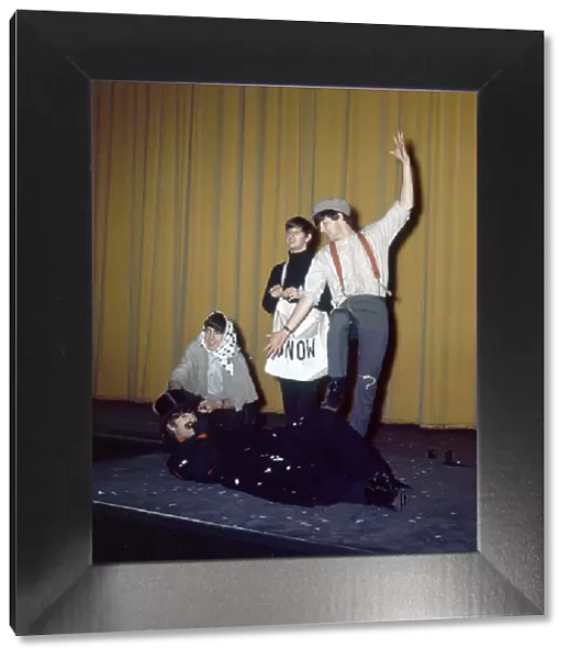 The Beatles in costume seen here rehearsing on stage for their Christmas Show at
