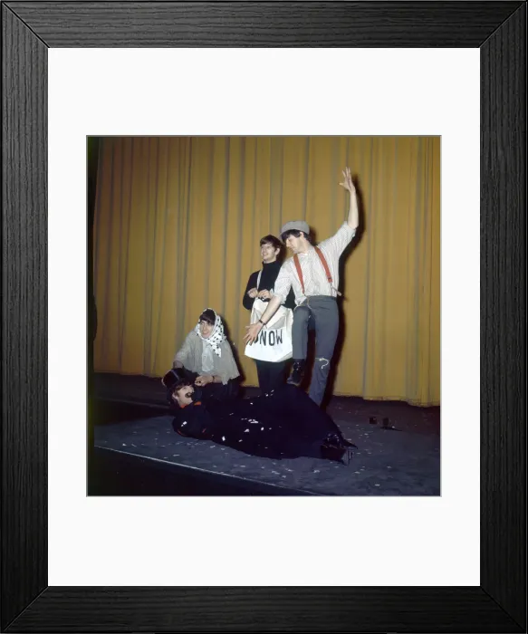 Framed Print : The Beatles in costume seen here rehearsing on stage for their Christmas Show