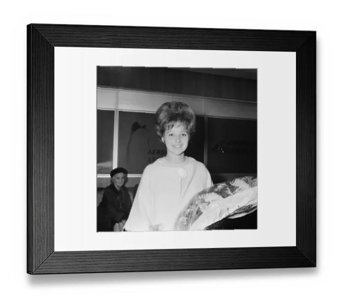 Framed Print : American pop singer Brenda Lee smiles upon arrival at London airport