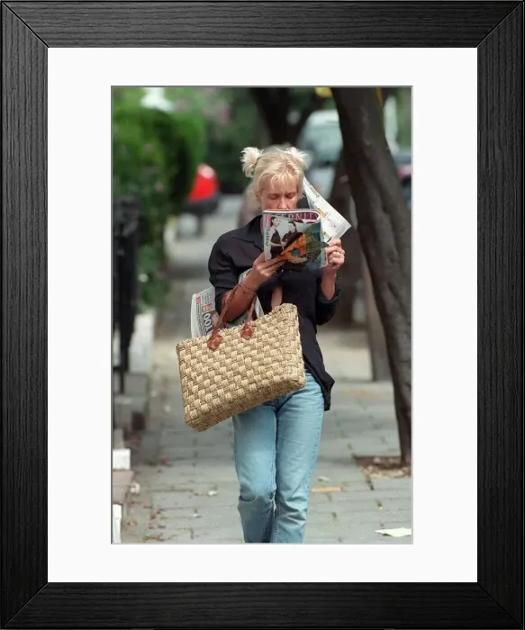 Framed Print : Paula Yates TV Presenter August 1998 Walking down the street reading a magazine Framed Print : Paula Yates TV Presenter August 1998 Walking down the street reading a magazine