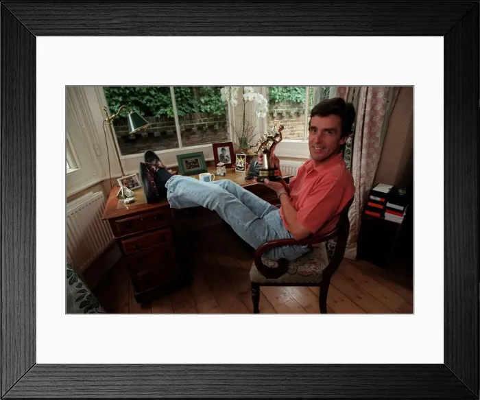 Framed Print : John Satpleton TV Presenter September 1998 At home sitting on his desk