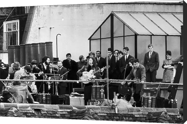Beatles on the rooftop of their Apple headquarters in Londons Saville Row making a short