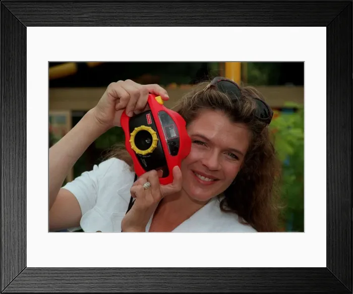 Framed Print : Annabel Croft TV Presenter July 1998 Holding camera A©mirrorpix