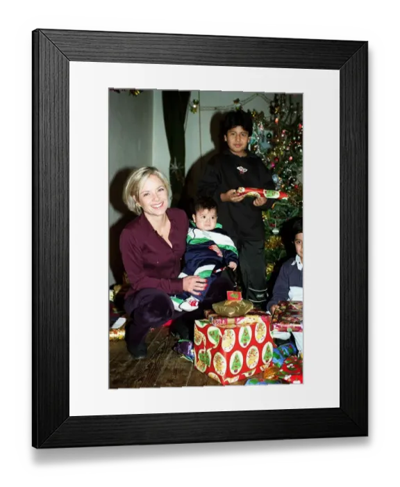 Framed Print : Mariella Frostrup TV Presenter  /  Film Critic December 1997 Handing out christmas presents