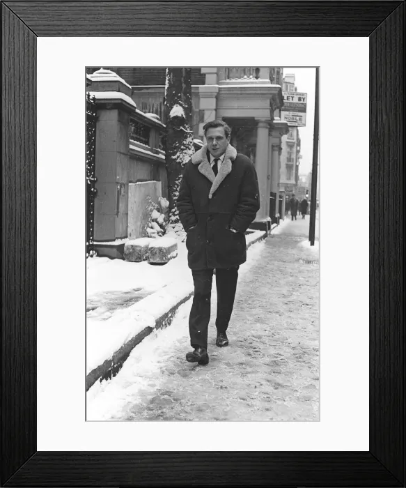 Framed Print : TV Presenter David Attenborough - March 1965 - walking to work on a snowy morning the day