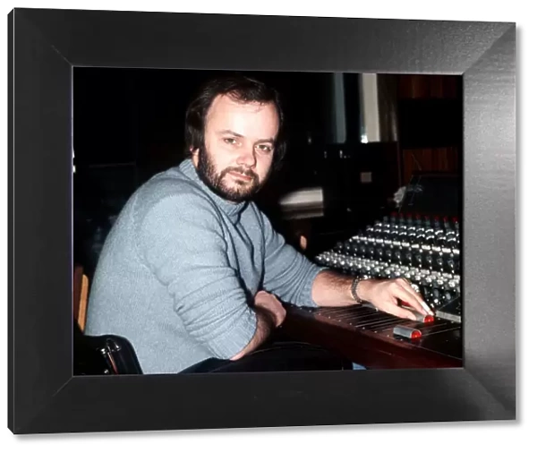 DJ John Peel in radio one studio sitting by mixing desk 1976 John Peel BBC Radio
