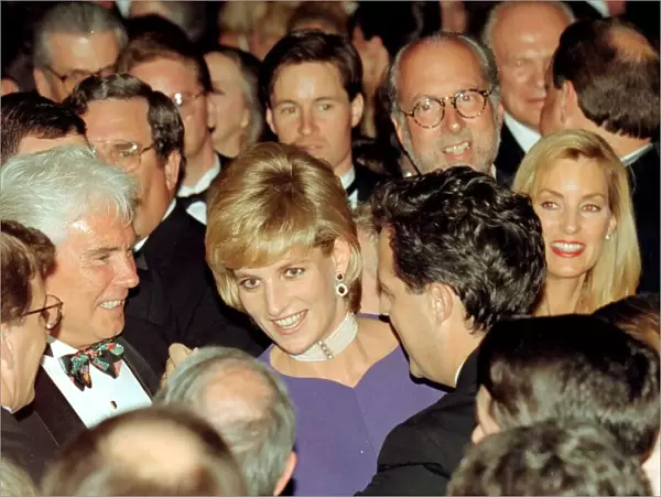 Diana, Princess of Wales, surrounded by people as she dances with Grant McCullagh at a