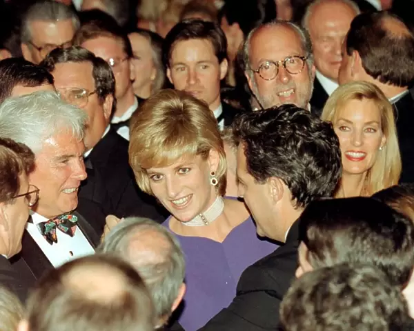 Diana, Princess of Wales, surrounded by people as she dances with Grant McCullagh at a