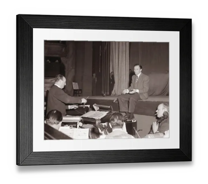 Framed Print : American singer and film star Frank Sinatra sitting on stage during rehearsals