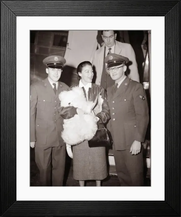 Framed Print : Ava Gardner arriving at London Airport talking to a pilot December 1954