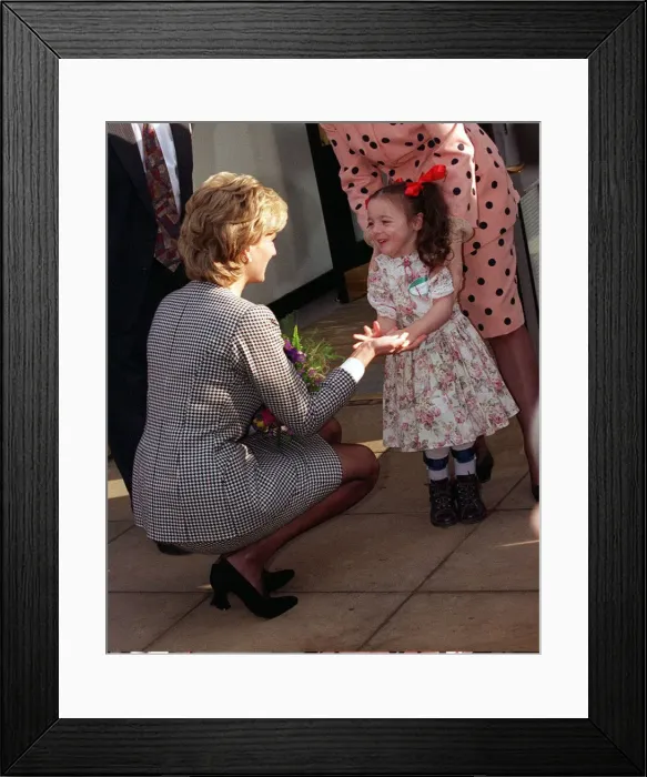 Framed Print : Princess Diana shaking the hand of a youngster who attends the Institute for Conductive