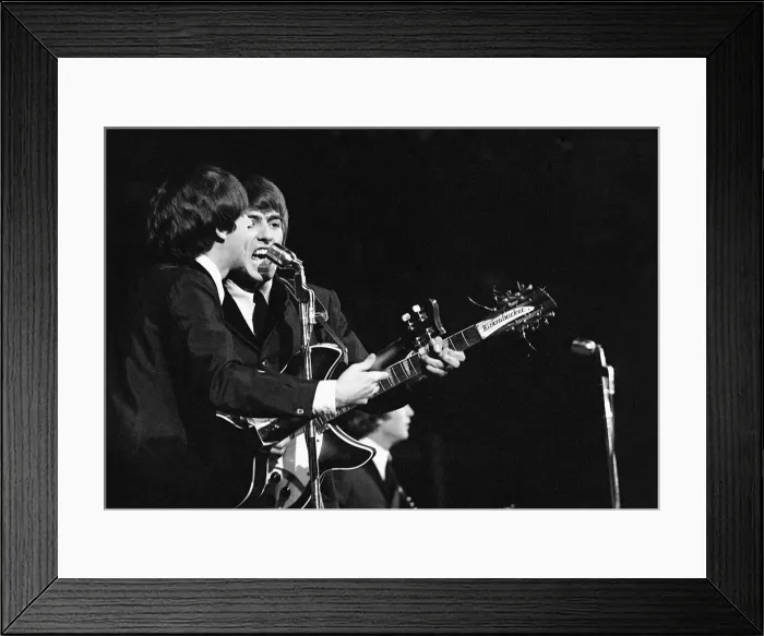 Framed Print : Paul McCartney and George Harrison in concert on the second night of their US tour
